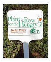 Sign in a garden that says Plant a Row for the Hungry with Garden Writers Association of America and HGTV logos below it