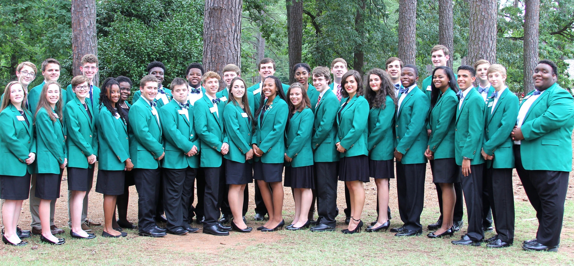 Group photo of 4-H'ers in matching green 4-H blazers