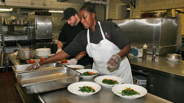 Food Prep workers cooking veggies and plating